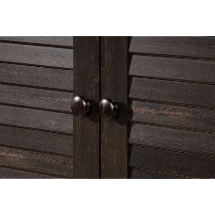 Close-up of Napoli Shutter Armoire in Antiqued Paint, highlighting the louvered doors and round wooden knobs.