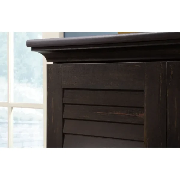 Close-up of the Napoli Shutter Armoire in Antiqued Paint, showcasing its detailed crown molding and shutter-style door design Close-up of the Napoli Shutter Armoire in Antiqued Paint, showcasing its detailed crown molding and shutter-style door design