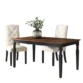 Lancaster 60-inch dining table with a solid wood brown top, black base, turned legs, and two upholstered chairs