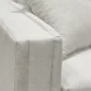 Upholstered sofa armrest close view.