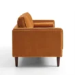 Side profile of orange sofa.