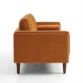 Side profile of orange sofa.