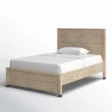 A single barnwood bed featuring a rustic wooden frame with a simple, elegant headboard, paired with a white mattress and pillows for a cozy, minimalistic look