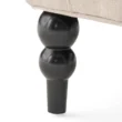 Close-up of Cambridge Wingback Chair - Black Wooden Leg with Elegant Turned Design, Sturdy Construction