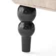 Close-up of Cambridge Wingback Chair - Black Wooden Leg with Elegant Turned Design, Sturdy Construction