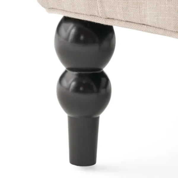 Close-up of Cambridge Wingback Chair - Black Wooden Leg with Elegant Turned Design, Sturdy Construction Close-up of Cambridge Wingback Chair - Black Wooden Leg with Elegant Turned Design, Sturdy Construction