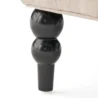 Close-up of Cambridge Wingback Chair - Black Wooden Leg with Elegant Turned Design, Sturdy Construction