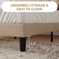 Close-up of Beige Upholstered Bed with 6.3-inch Black Legs, Highlighting Underbed Storage and Easy-to-Clean Features