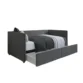 Gray Nestora Daybed with pull-out trundle storage, featuring a modern upholstered design.