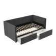 Gray Nestora Daybed with wooden slats and two pull-out storage drawers, showcasing its sturdy and functional design.