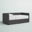 Gray Nestora Daybed with a sleek, modern design and upholstered frame, perfect for a stylish and functional sleeping space.