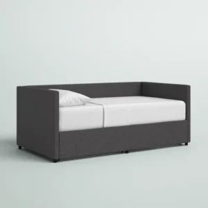 Gray Nestora Daybed with a sleek, modern design and upholstered frame, perfect for a stylish and functional sleeping space.