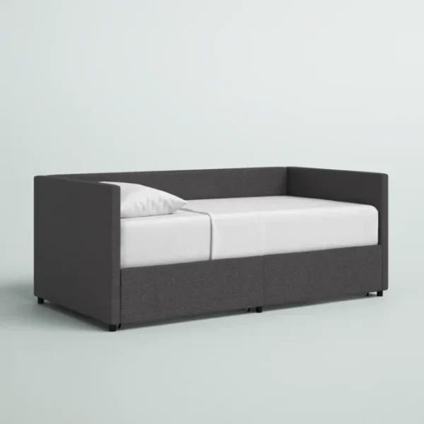 Gray Nestora Daybed with a sleek, modern design and upholstered frame, perfect for a stylish and functional sleeping space.
