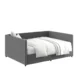 Gray Nestora Daybed with plush bedding, offering a modern and stylish sleeping solution with a comfortable upholstered frame