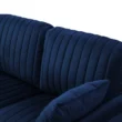 Close-up of Aurello Velvet Chair’s tufted backrest and cushion in navy blue velvet.