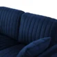 Close-up of Aurello Velvet Chair’s tufted backrest and cushion in navy blue velvet.