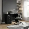 black writer desk with a grey rolling chair in a modern room