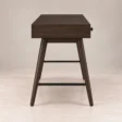 Side view of Script Trestle Writing Desk in Walnut finish showing the wooden trestle leg structure