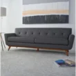 Allure Upholstered Comfort Sofa in gray, featuring a sleek mid-century modern design with tufted cushions and wooden legs, perfect for adding style and comfort to any living room