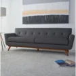 Allure Upholstered Comfort Sofa in gray, featuring a sleek mid-century modern design with tufted cushions and wooden legs, perfect for adding style and comfort to any living room