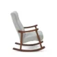 Side profile view of grey rocking chair