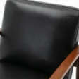 Close-up of Monarch Leather Armchair – Black Faux Leather Upholstery with Wooden Armrest