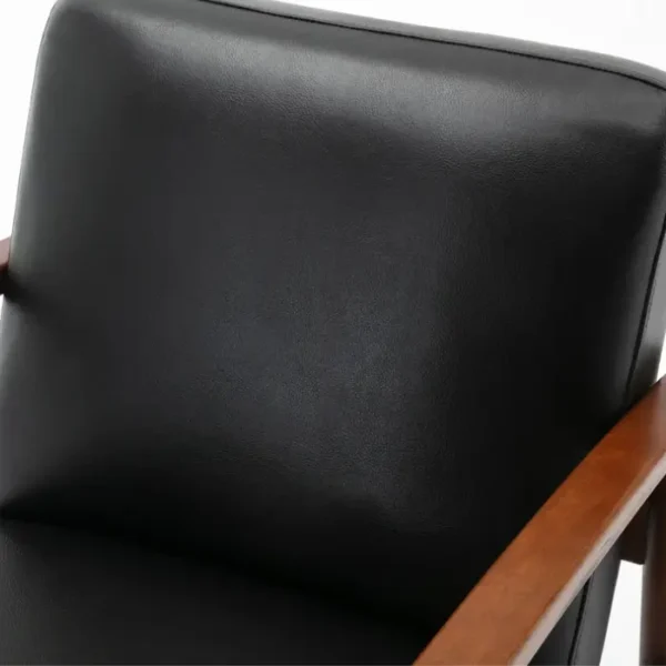 Close-up of Monarch Leather Armchair – Black Faux Leather Upholstery with Wooden Armrest Close-up of Monarch Leather Armchair – Black Faux Leather Upholstery with Wooden Armrest