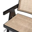 Chaya Cane Armchair close-up with woven cane seat and backrest, black wooden frame