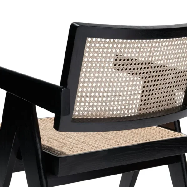 Chaya Cane Armchair close-up of woven cane backrest and seat with black wooden frame Chaya Cane Armchair close-up of woven cane backrest and seat with black wooden frame
