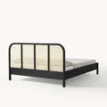 back view of black cane bed showing cane headboard