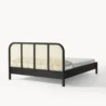 back view of black cane bed showing cane headboard