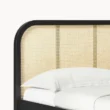 close view of bed's cane headboard