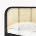 close view of bed's cane headboard