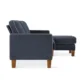 Side view of Harbor Sectional Sofa in navy blue fabric with contrast piping and wooden legs.