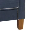 Close-up of Harbor Sectional Sofa leg and piping detail in navy blue fabric with light trim.