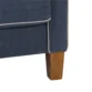 Close-up of Harbor Sectional Sofa leg and piping detail in navy blue fabric with light trim.