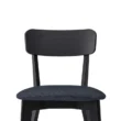 Close-up of Roco Lisette dining chair with curved black backrest and cushioned dark fabric seat.