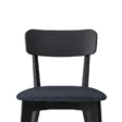 Close-up of Roco Lisette dining chair with curved black backrest and cushioned dark fabric seat.