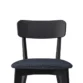 Close-up of Roco Lisette dining chair with curved black backrest and cushioned dark fabric seat.