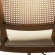 back view of office chair showing cane backrest and premium upholstery.