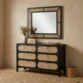 Black dresser in a modern room with matching mirror
