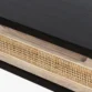 Close-up of Delilah Cane Desk drawer with woven cane panel and black wood top