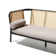 Black cane sofa with beige cushions, featuring a solid wood frame and handwoven rattan backrest