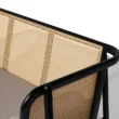 Close-up of black cane sofa with handwoven rattan backrest and beige cushion, featuring a solid wood frame