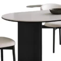 Close-up of Orbis Dining Table with Matte Cream Top and Black Base