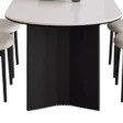 Base detail of Orbis Dining Table with curved black support and rounded top