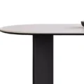 Side view of Orbis Dining Table with rounded top and black central support