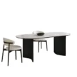 Orbis Dining Table with black curved legs and cream chairs