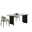 Orbis Dining Table with black curved legs and cream chairs
