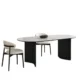 Orbis Dining Table with black curved legs and cream chairs